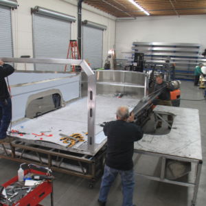 2016-02-03 Aerovault Construction 023 Arial view on installation of side sheet on Aerovault trailer