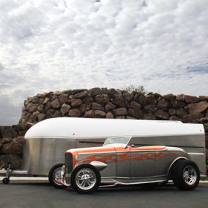 Our goal with the Aerovault is to extend the passion people feel for their automobiles and motorcycles to include their trailer and bring joy to the journey of towing. When we see someone use an Aerovault as a backdrop to photographing their pride and joy car, we know we're doing something special. Enclosed Aerovault trailer with hot rod