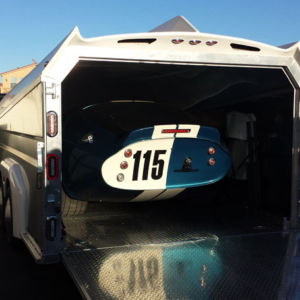 This beautiful Daytona Cobra Coupe wasn’t going to a track. It was going home to the “Carroll Collection” museum in Michigan. coupe replica in trailer